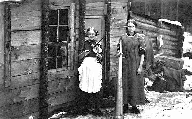 Women cooks (Martha and Clara Stene) in front of logging camp cookshack, Bill Landahl Camp, Beltrami County, ca. 1917.