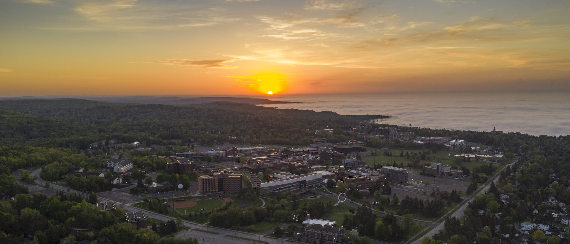 An aerial shot of the UMD campus at sunrise.